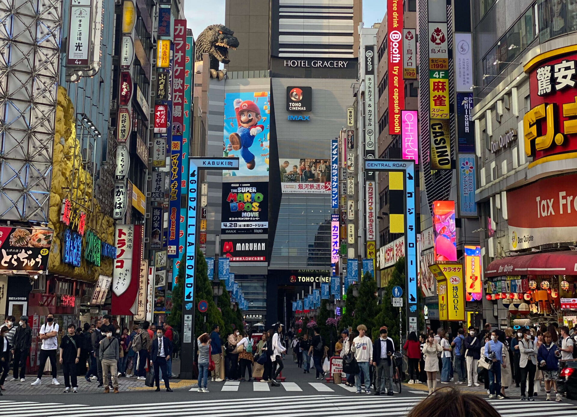 Shinjuku city street in japan with neon lights and a crosswalk - tokyo 2 day itinerary