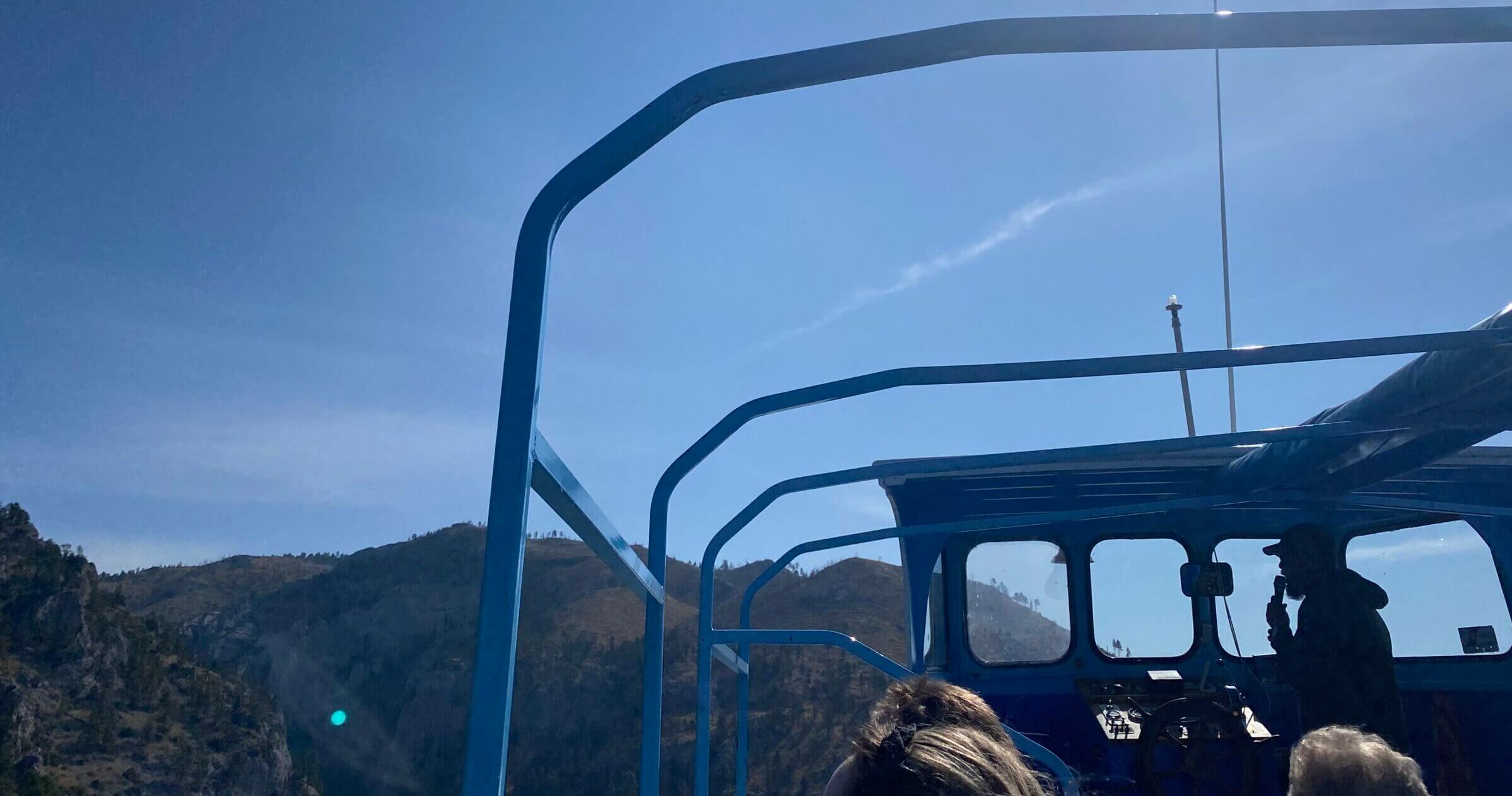 view from a boat of mountains and water