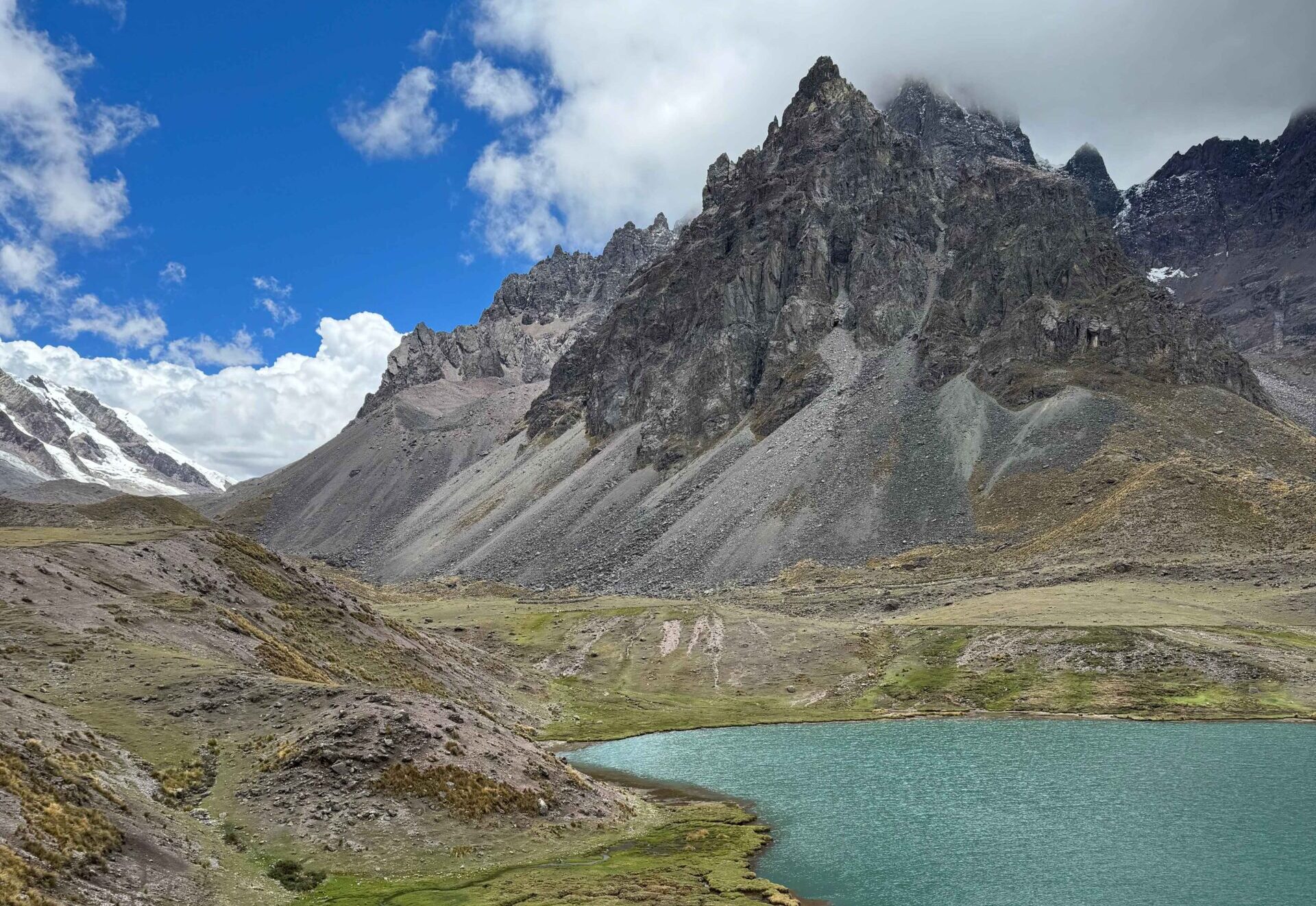 blue lake with big grey mountain