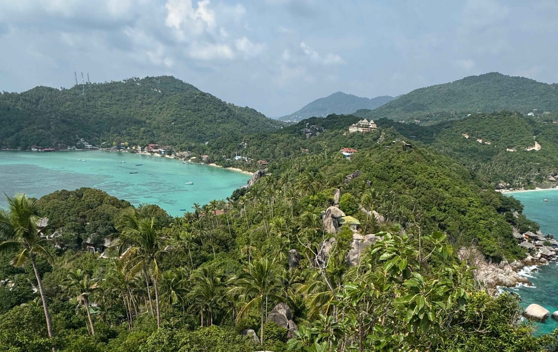 John Suwan Viewpoint in Koh Tao Thailand with blue water and green mountains