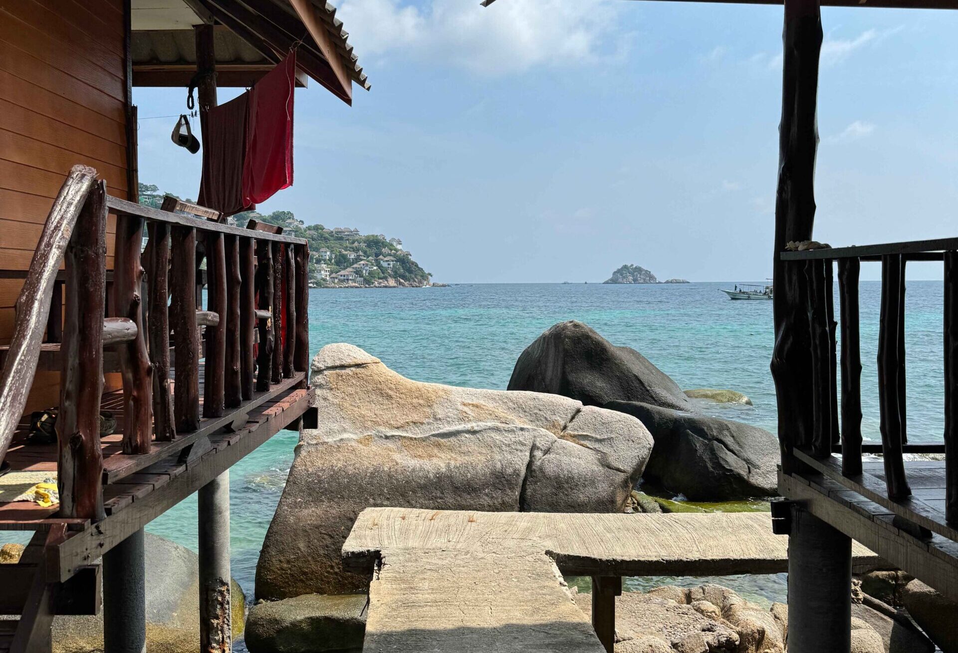 entrance to Shark Bay - best beaches on koh tao. Bungalows on the water with a sidewalk leading to the ocean