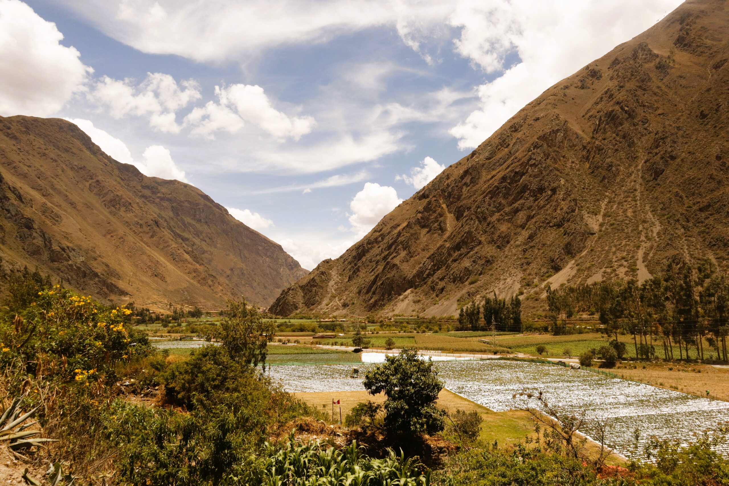 sacred valley with mountains and river - best day trips from Cusco