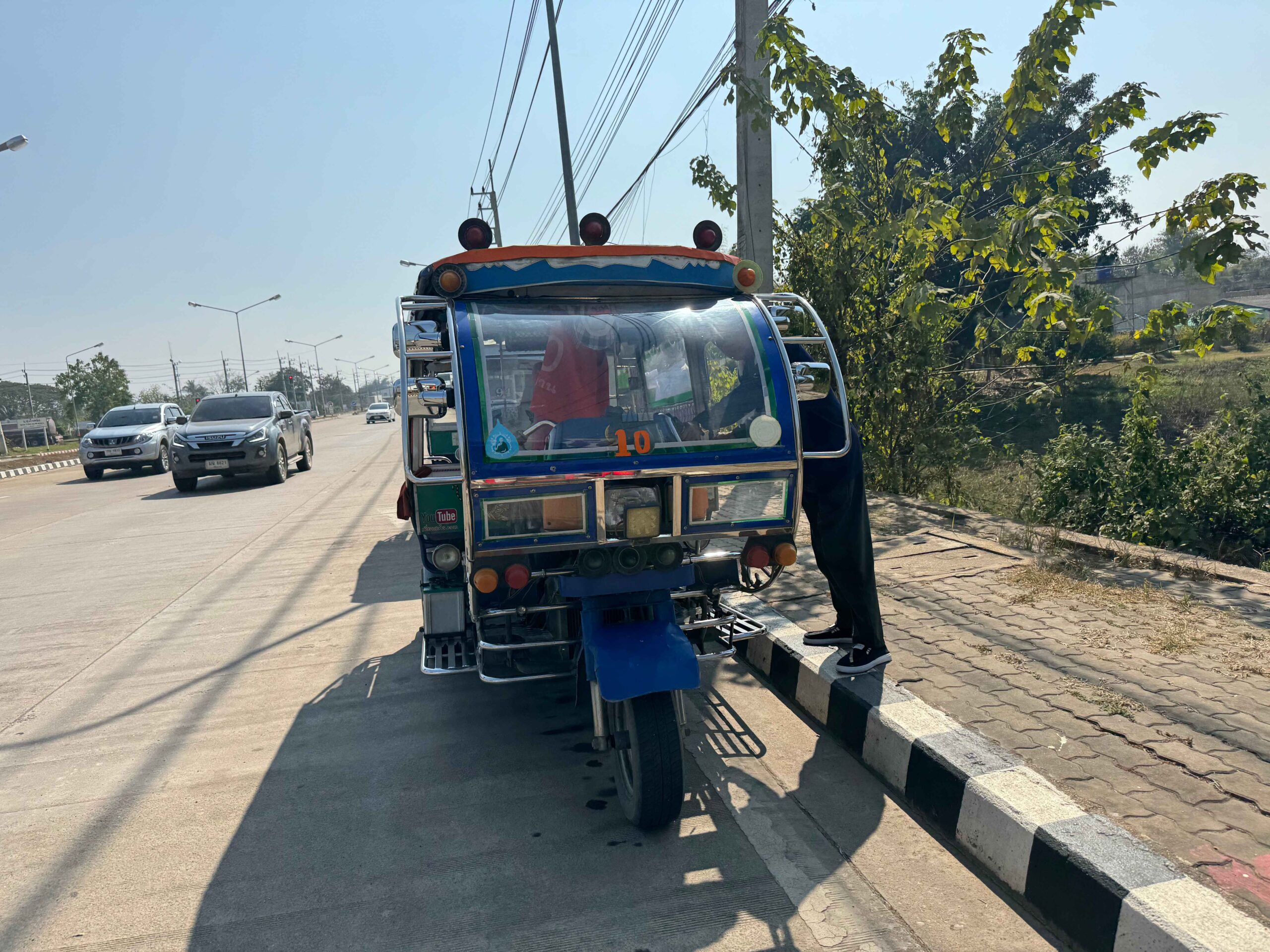 tuk tuk in Thailand on the side of the road