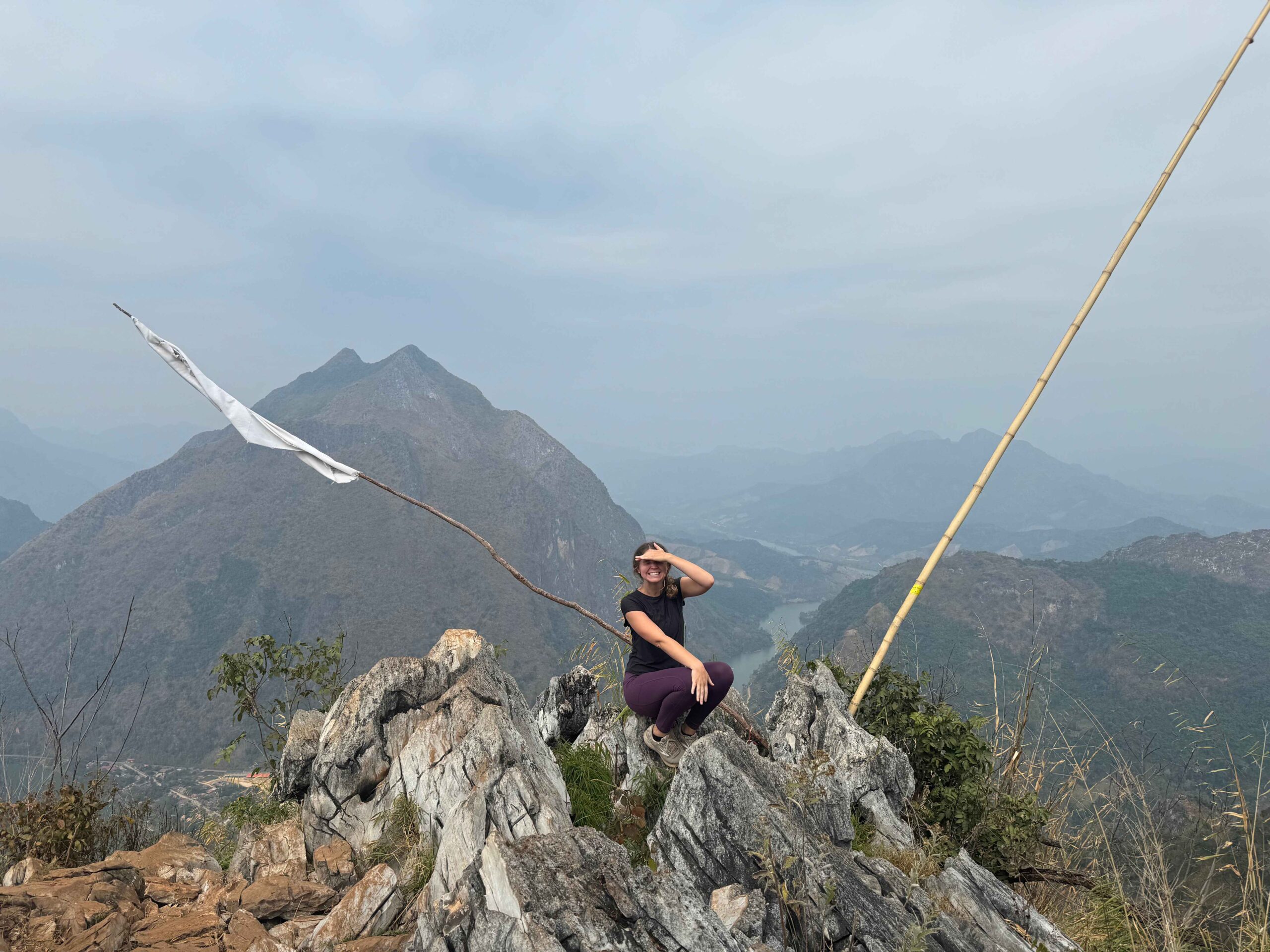 Pha Khao Viewpoint in Nong Khiaw. Person standing at the top of a mountain