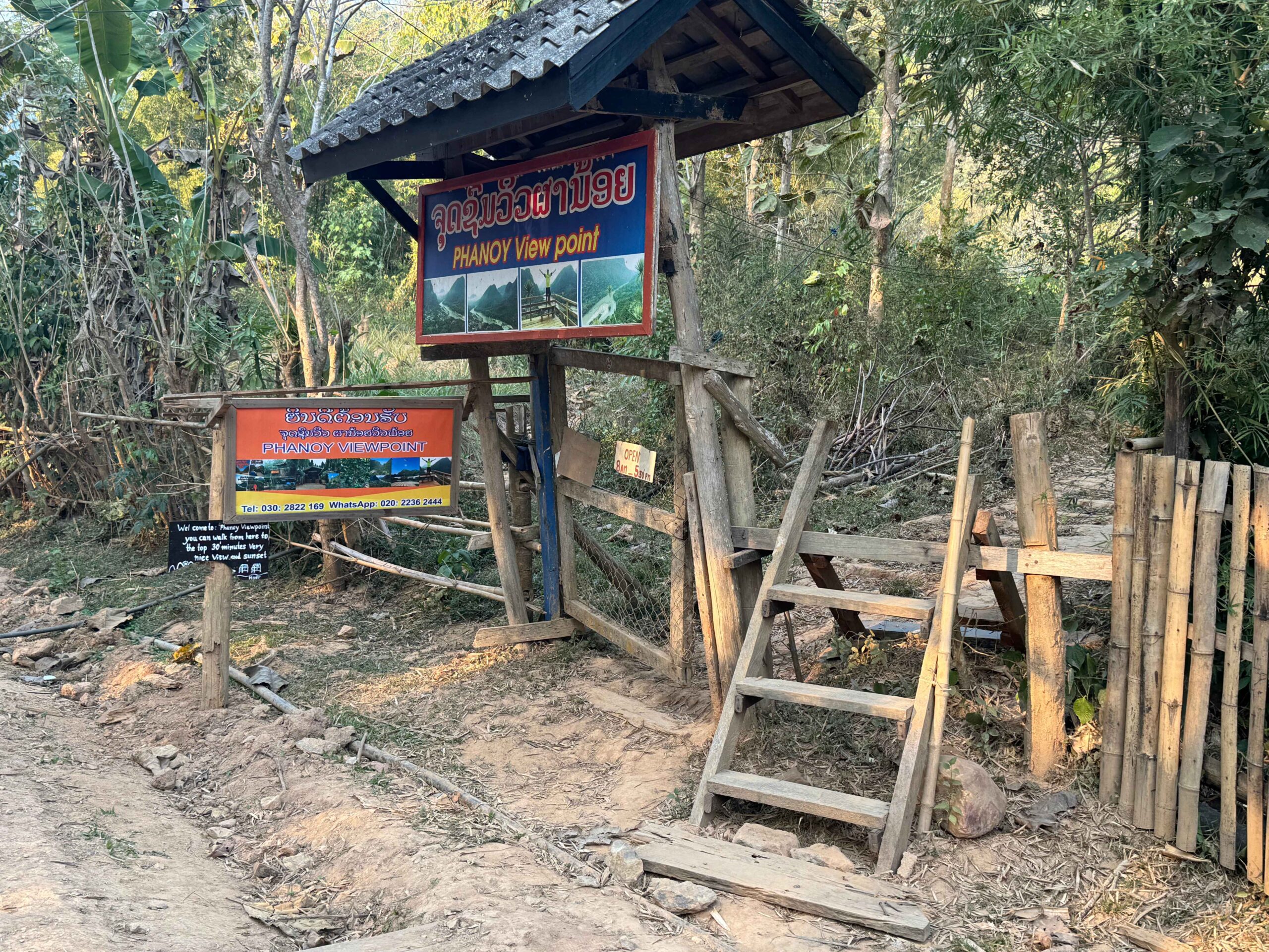 Phanoi Viewpoint trailhead with a sign and a ladder