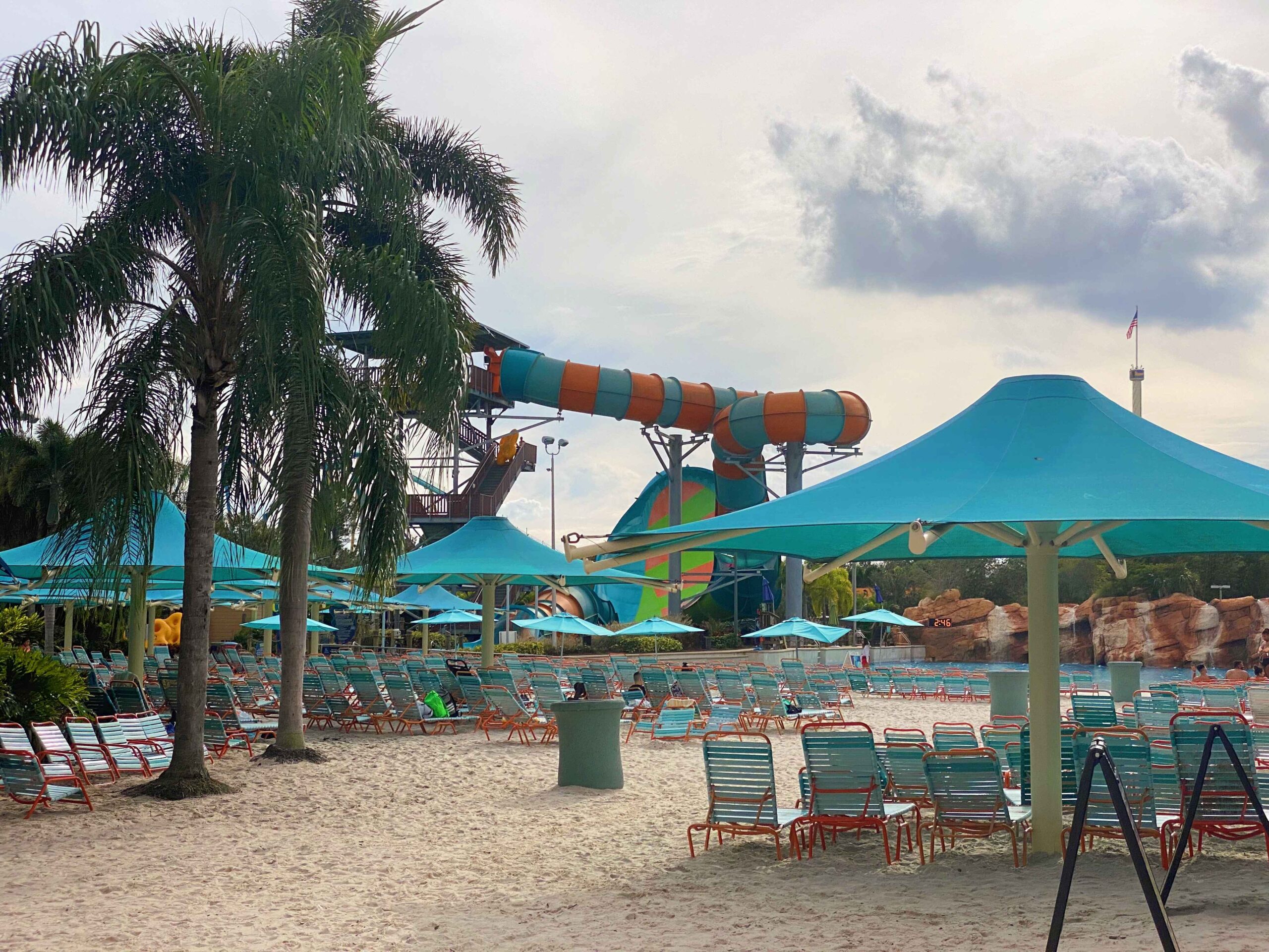 water park seating area with waterslide in the background